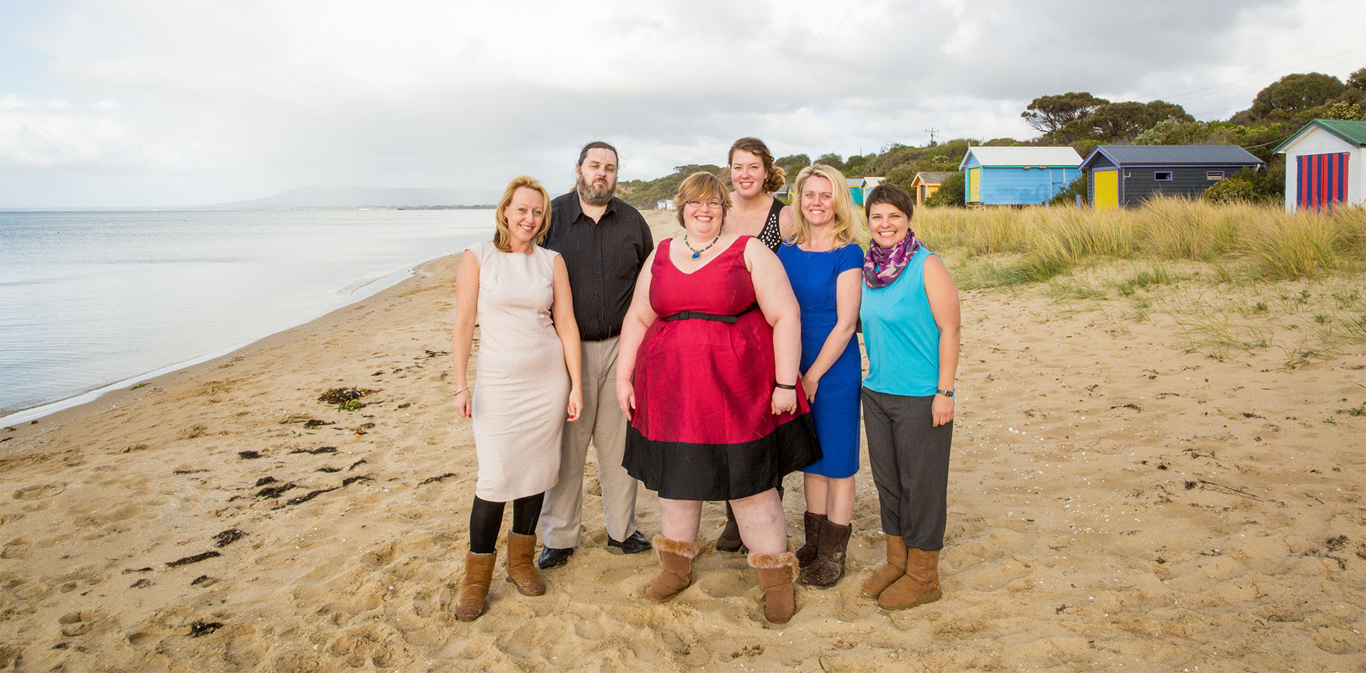 Left to right: Sarah, Matt, Gian, Charlotte, Alison, and Eliza on the beach.